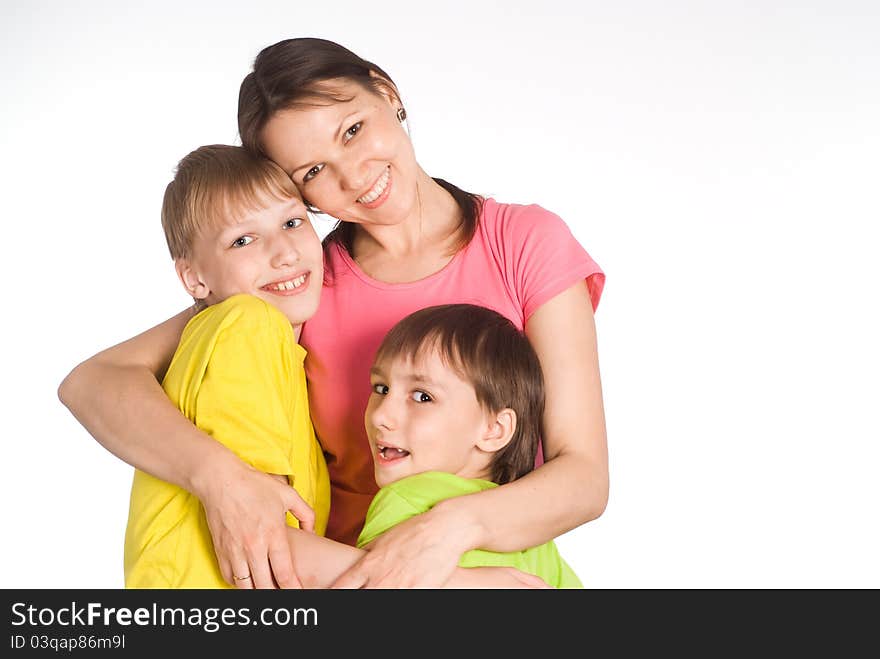 Cute mom with her boys on white. Cute mom with her boys on white