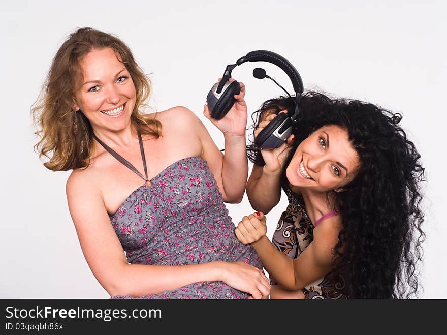 Portrait of a two cute girls with headphones. Portrait of a two cute girls with headphones