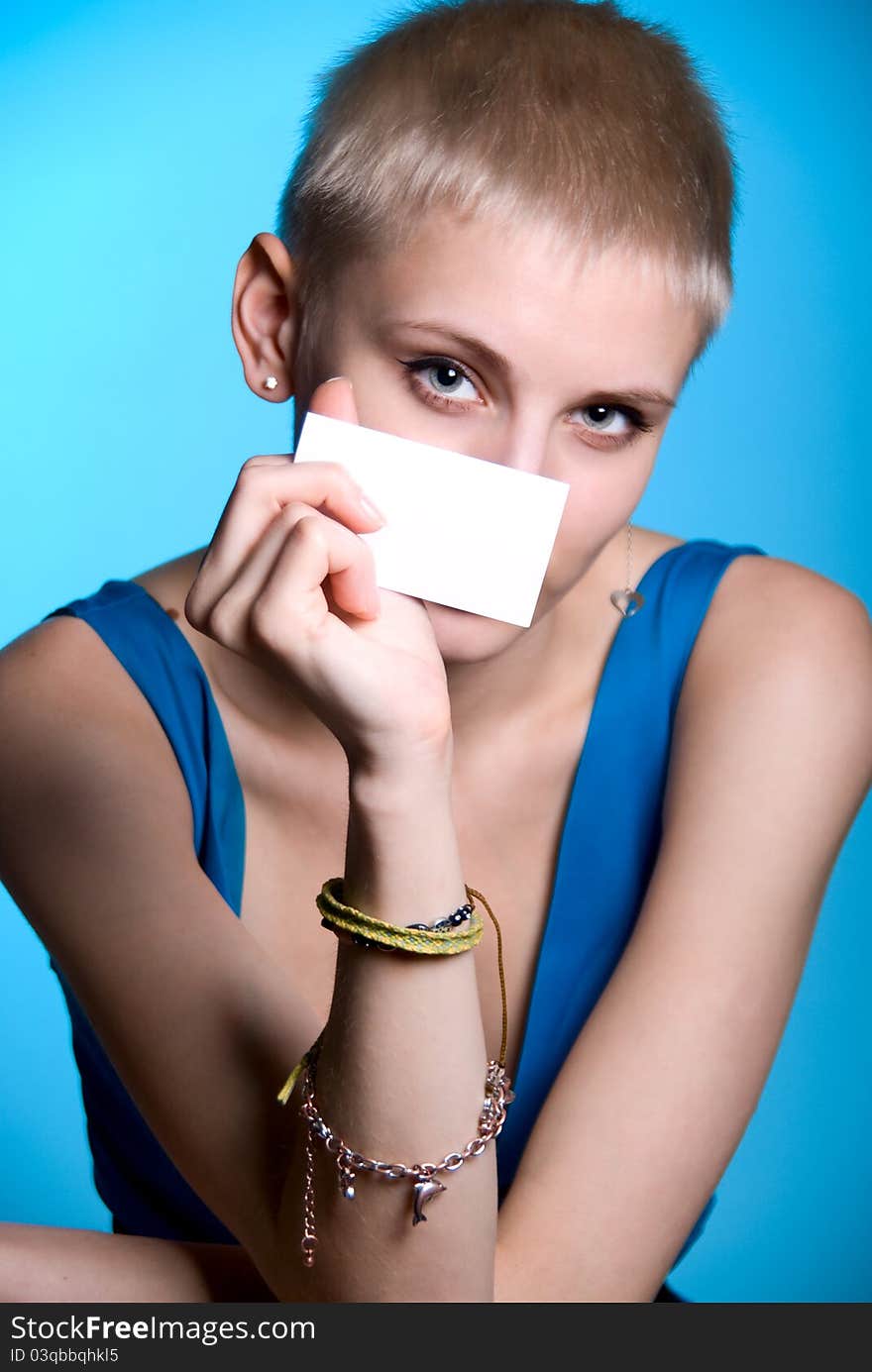 Portrait of a beautiful girl holding a blank notecard. Portrait of a beautiful girl holding a blank notecard.