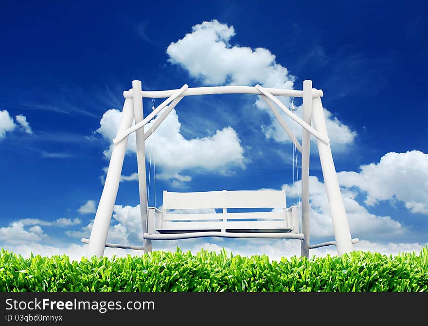 Abandoned swing on a field on a sunny day