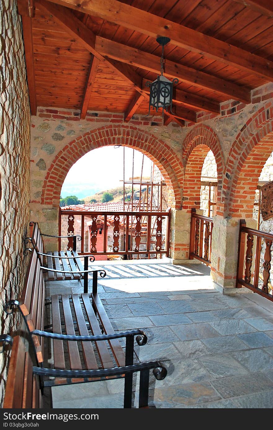 old balcony monastery of meteora with old chairs