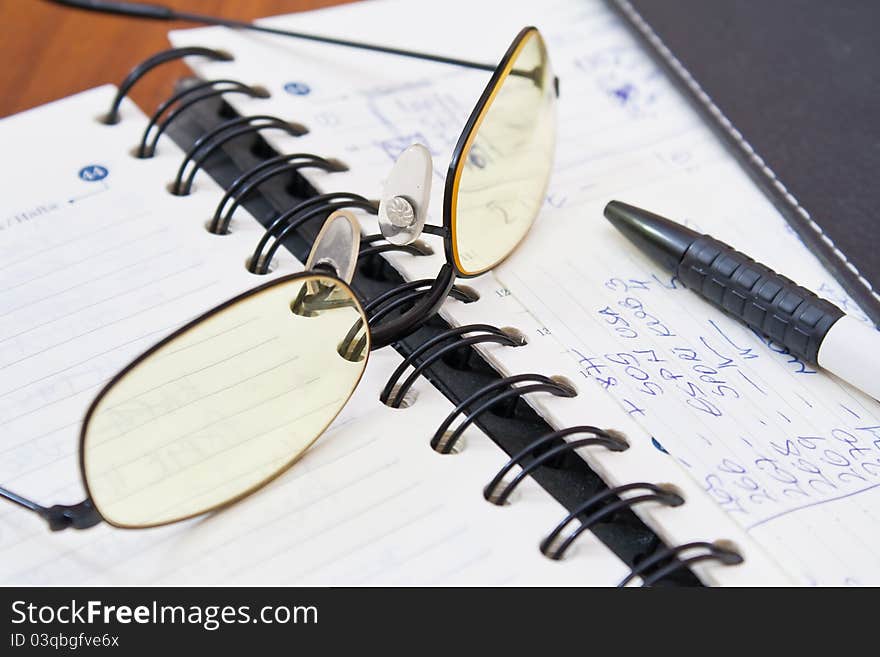 Open Notebook And Pen On The Table