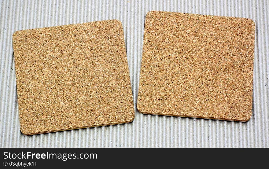 Two Blank Corkboards On Corrugated Paper