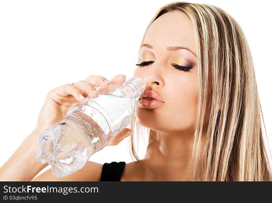 Young beautiful woman drinking water, white background