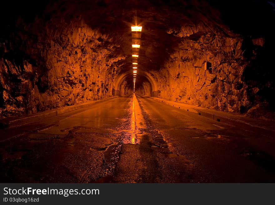 A tunnel that cuts through one of the mountains in Yosemite National Park. A tunnel that cuts through one of the mountains in Yosemite National Park.