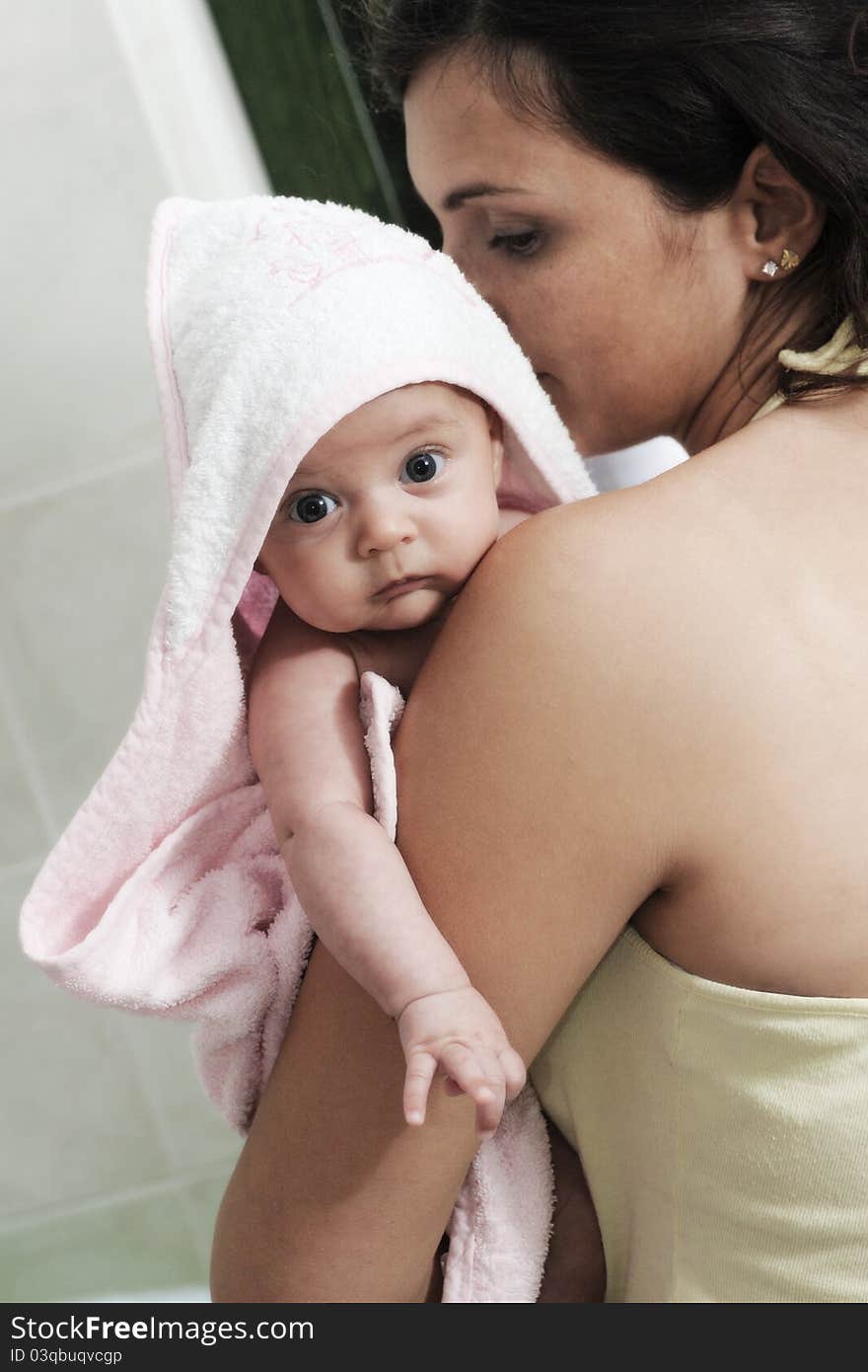 Baby In The Pink And White Bathrobe