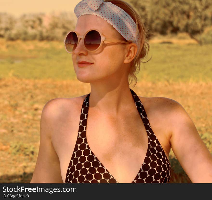 Portrait beautiful girl wearing sunglasses in an outdoor summer. Portrait beautiful girl wearing sunglasses in an outdoor summer