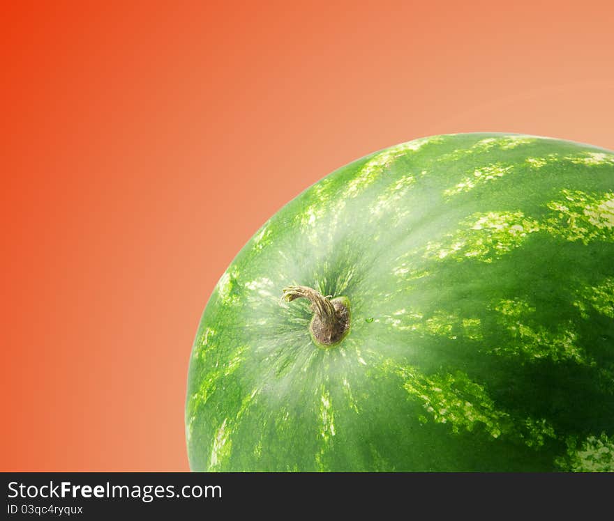 Ripe watermelon on a red background