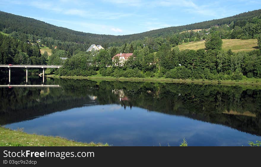 Crystal-clear river and the bridge on the left side