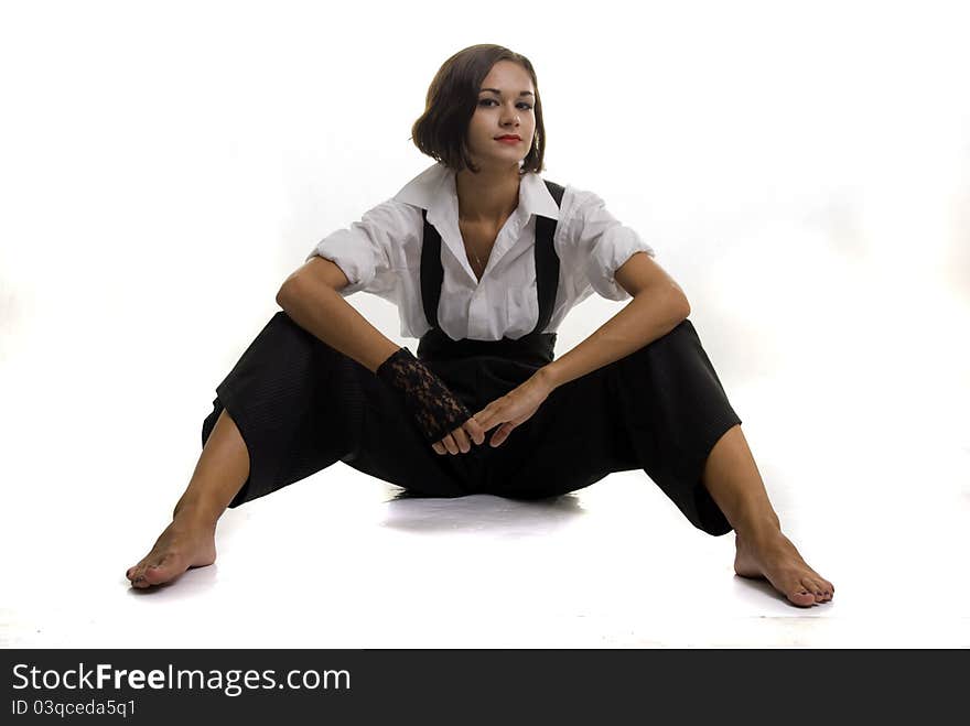 Beautiful girl sits on floor