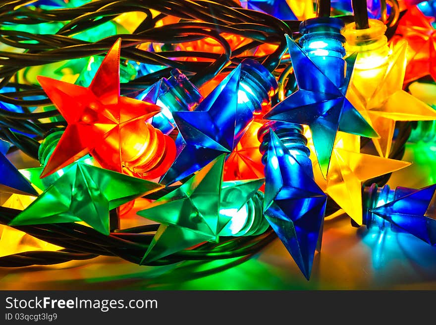 Garland of colored lights for Christmas trees. Spread out to a table