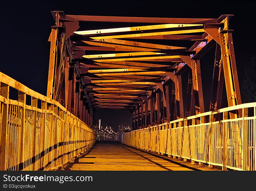 The strange bridge at night that conducts to electric wires. The strange bridge at night that conducts to electric wires