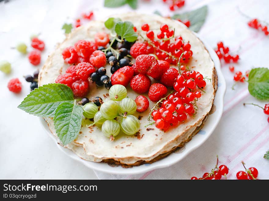 Pancakes with berries and mint