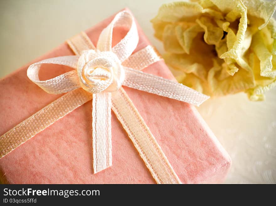 Pink gift box with a dry rose. Pink gift box with a dry rose.