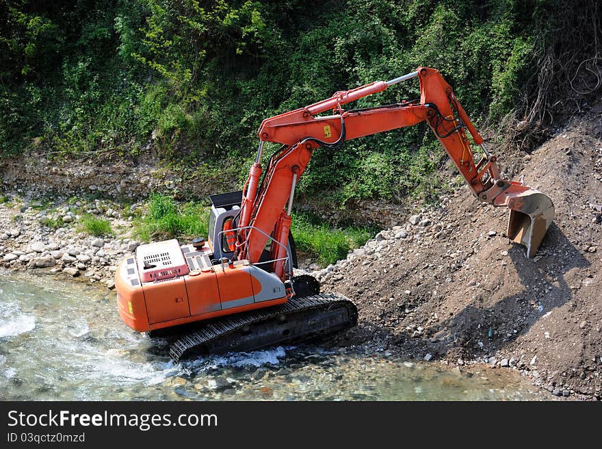 Excavator in the river