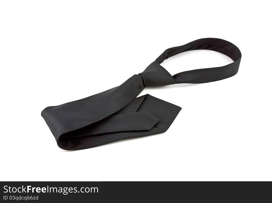 Black necktie on white background