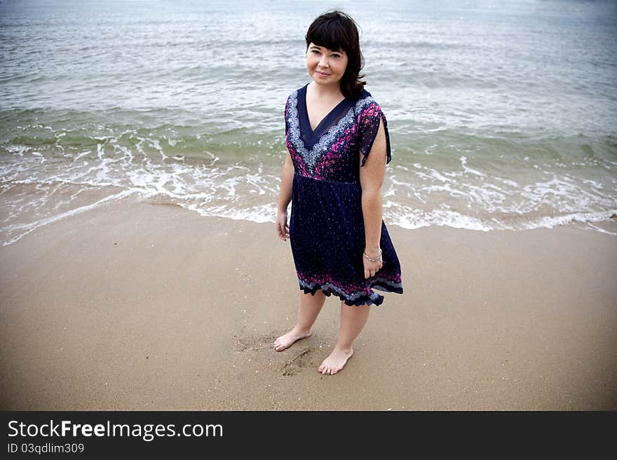 A portrait of a young girl on the beach.