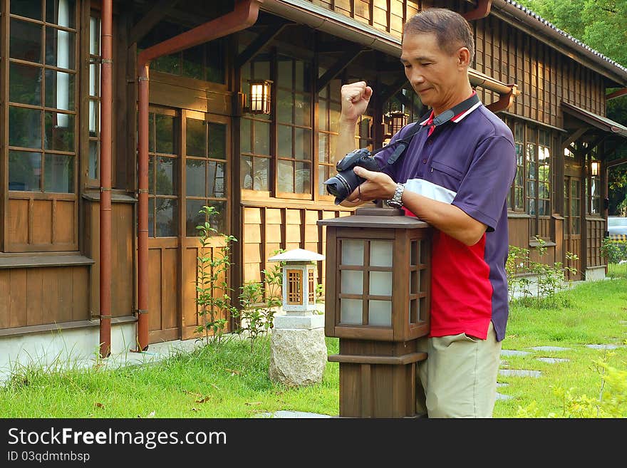 The Satisfied photographer who Watching Camera picture