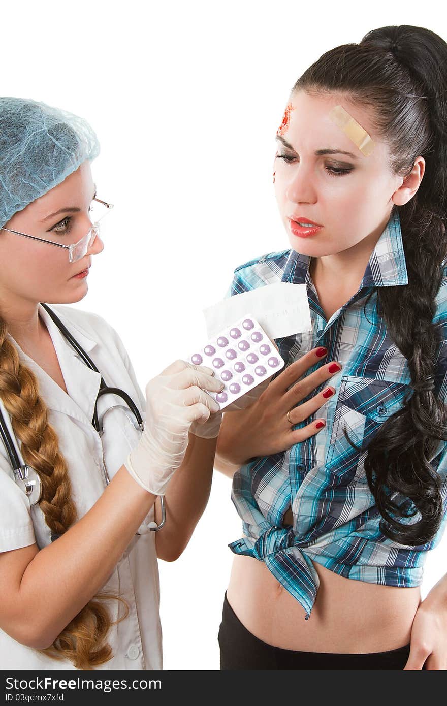 Beautiful nurse prescribed a tablet the patient on a white background. Beautiful nurse prescribed a tablet the patient on a white background