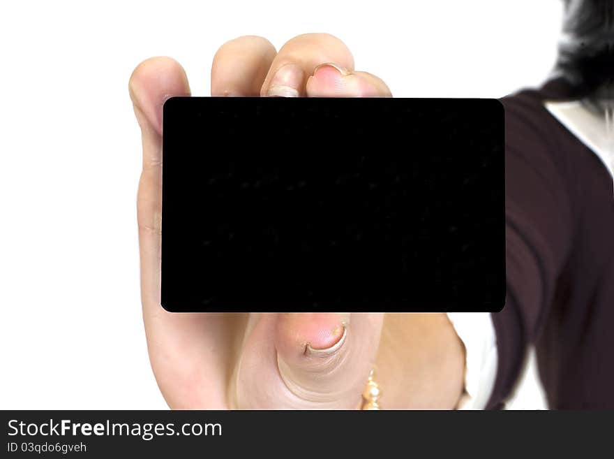 The female hand holding a bank card on a white background