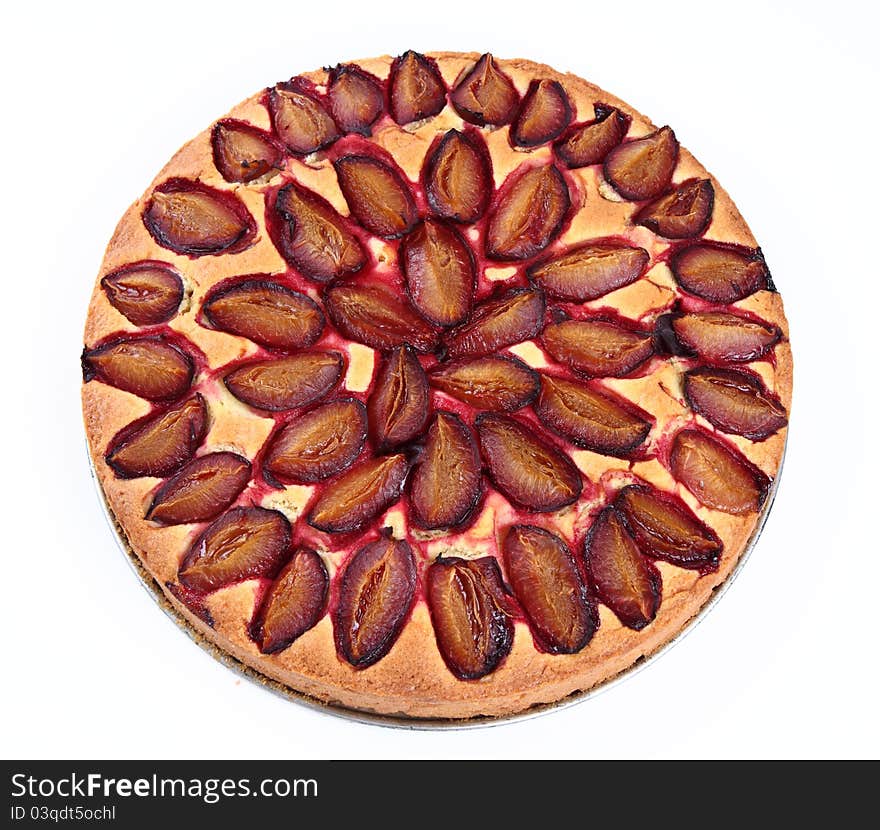 Plum pie on a white background