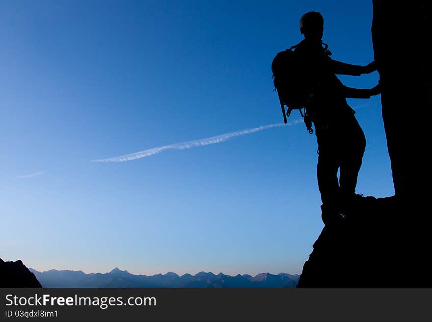 Silhouette of a climber with large copay space. Silhouette of a climber with large copay space