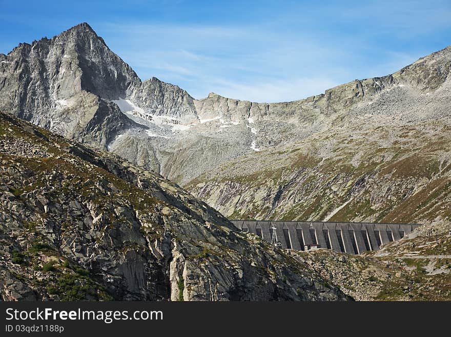 Dam and man-made lake between mountains. It’s Pantano Lake, North of Italy, Lombardy region, at 2.378 meters on the sea-level. Dam and man-made lake between mountains. It’s Pantano Lake, North of Italy, Lombardy region, at 2.378 meters on the sea-level