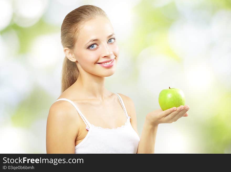 Smiling girl with green apple