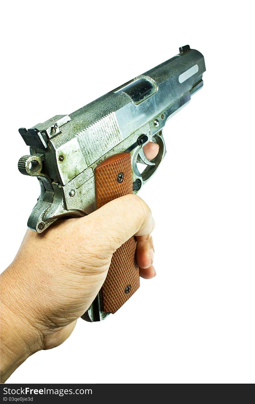 Gun in hand, isolated on a white background. Gun in hand, isolated on a white background.