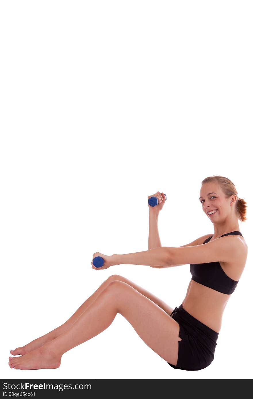 A young woman with dumbbells