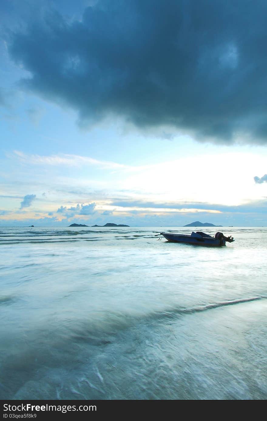 A boat in the sea with thunderstorm coming