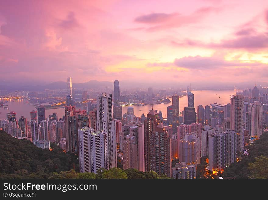 A pink sunrise with moving clouds. A pink sunrise with moving clouds.