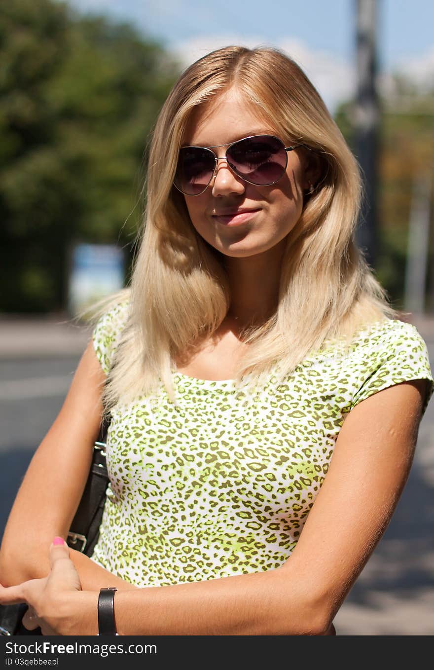 Portrait of beautiful girl in sunglasses in sunny day