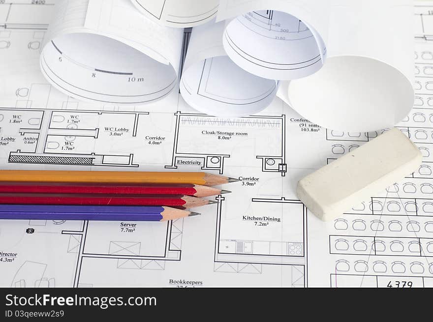 Architectural blueprint of office building with a pencils