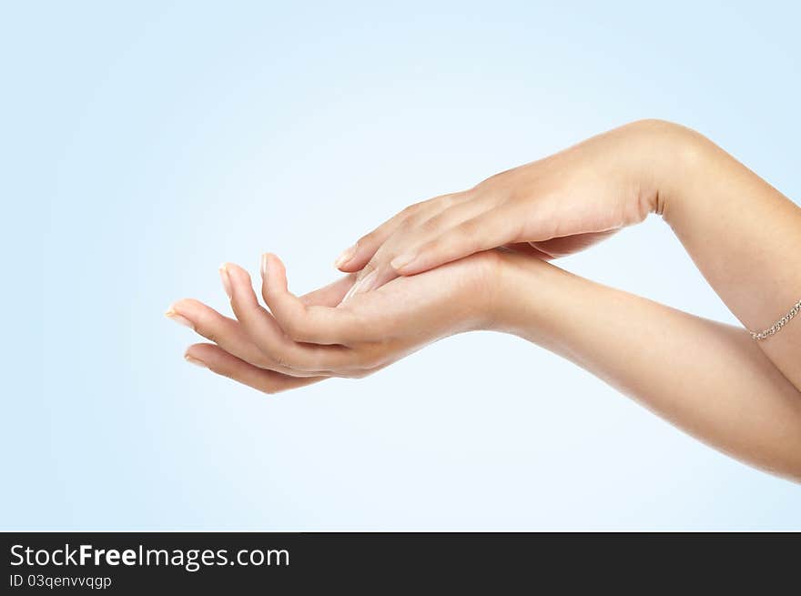 Women's hand on blue background