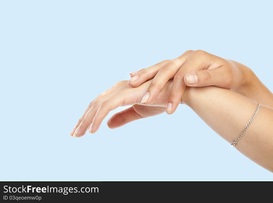 Women's hand on blue background