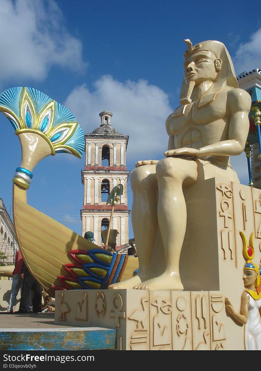 Float decorated with egyptian motives, with a pharaoh figure at front and a colonial church at bottom, at Remedios village, Cuba, as part of a carnival at the Christmas day.