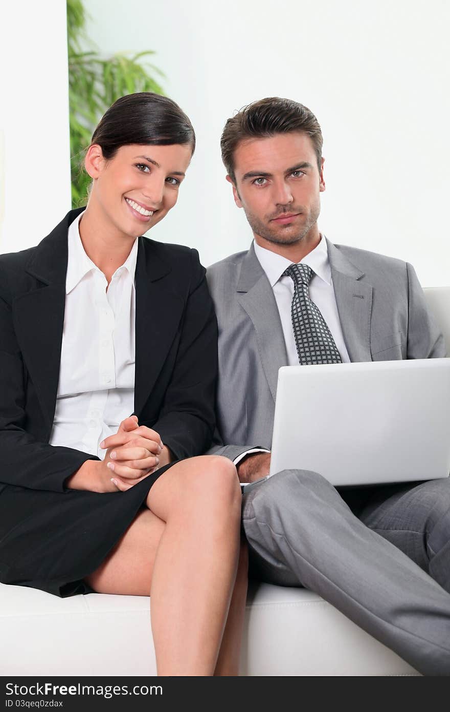 Business team in front of a laptop computer