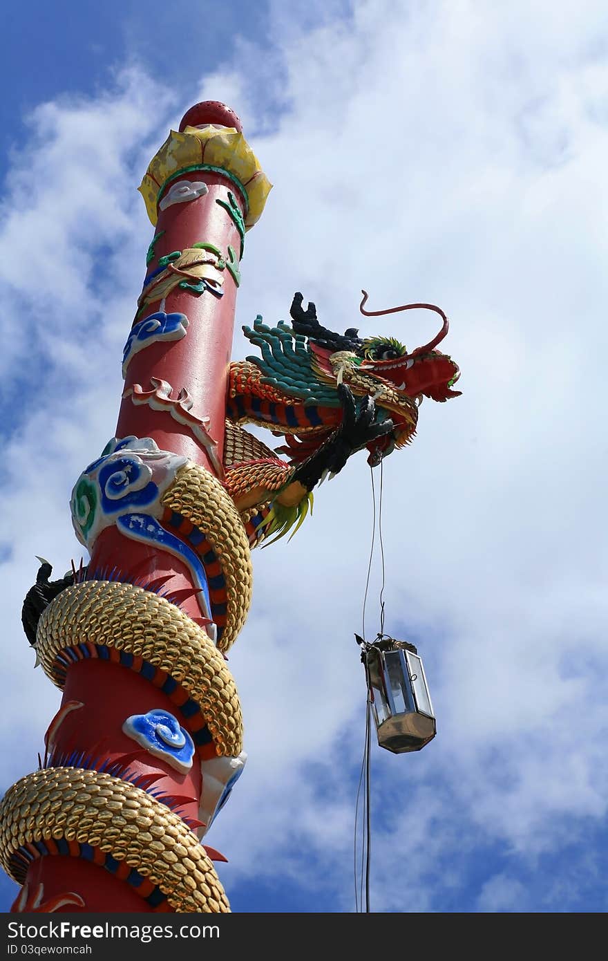 Dragon Statue on the red column in Chinese temple, Thailand