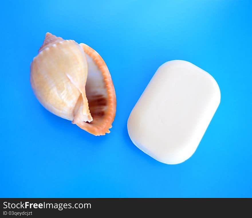 Beautiful piece of white soap on a blue background