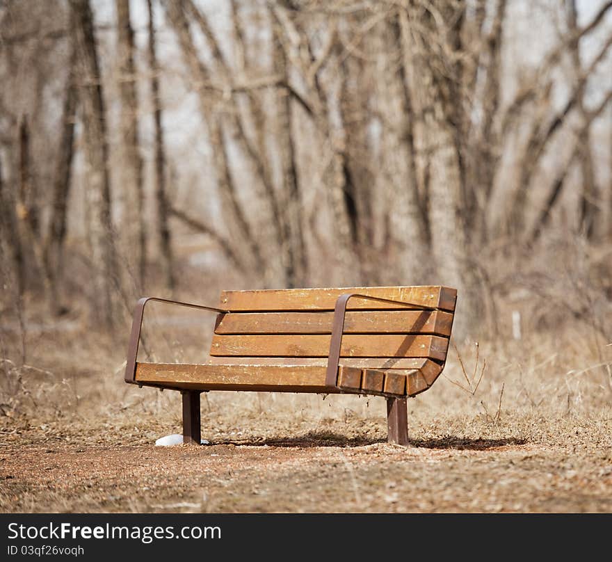 Park bench in bow valley park pathway Calgary Alberta. Park bench in bow valley park pathway Calgary Alberta