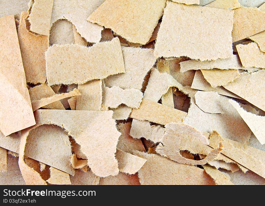 Close up of torn pieces of brown paper