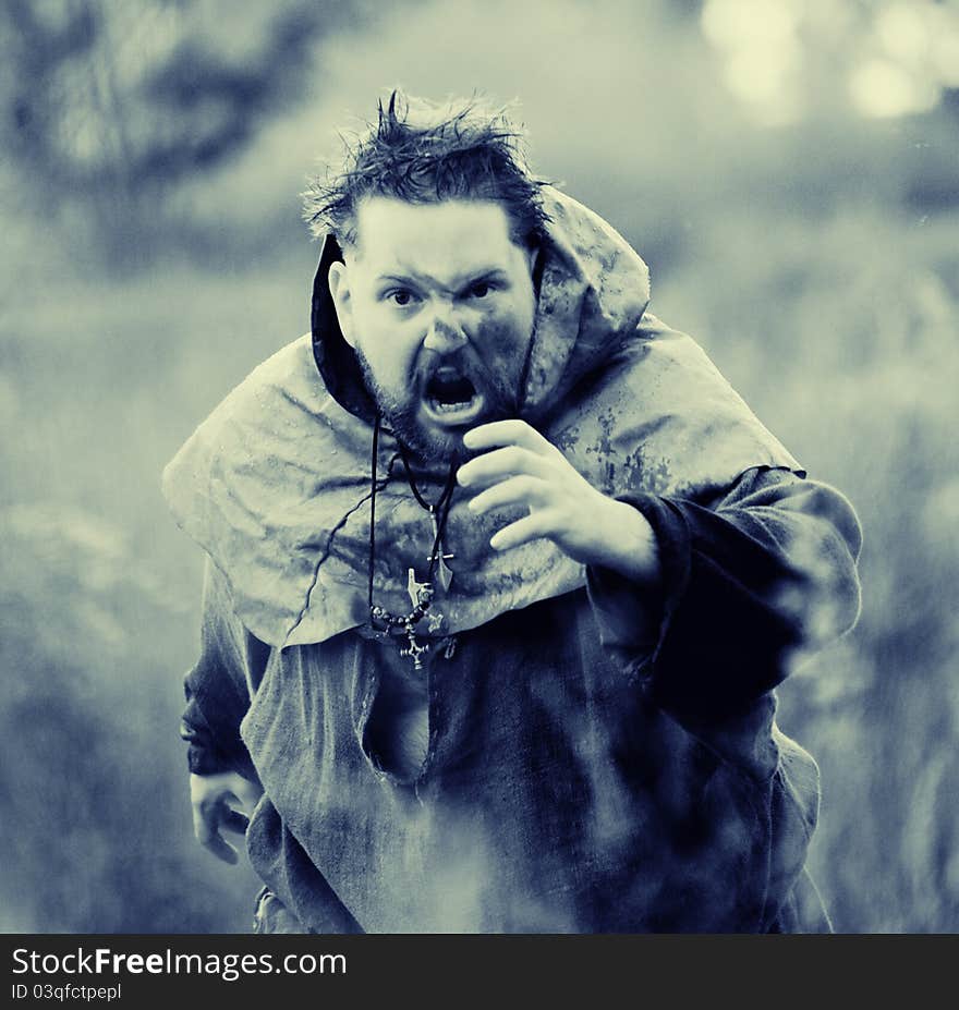 Man in medieval suit outdoor shot. Man in medieval suit outdoor shot