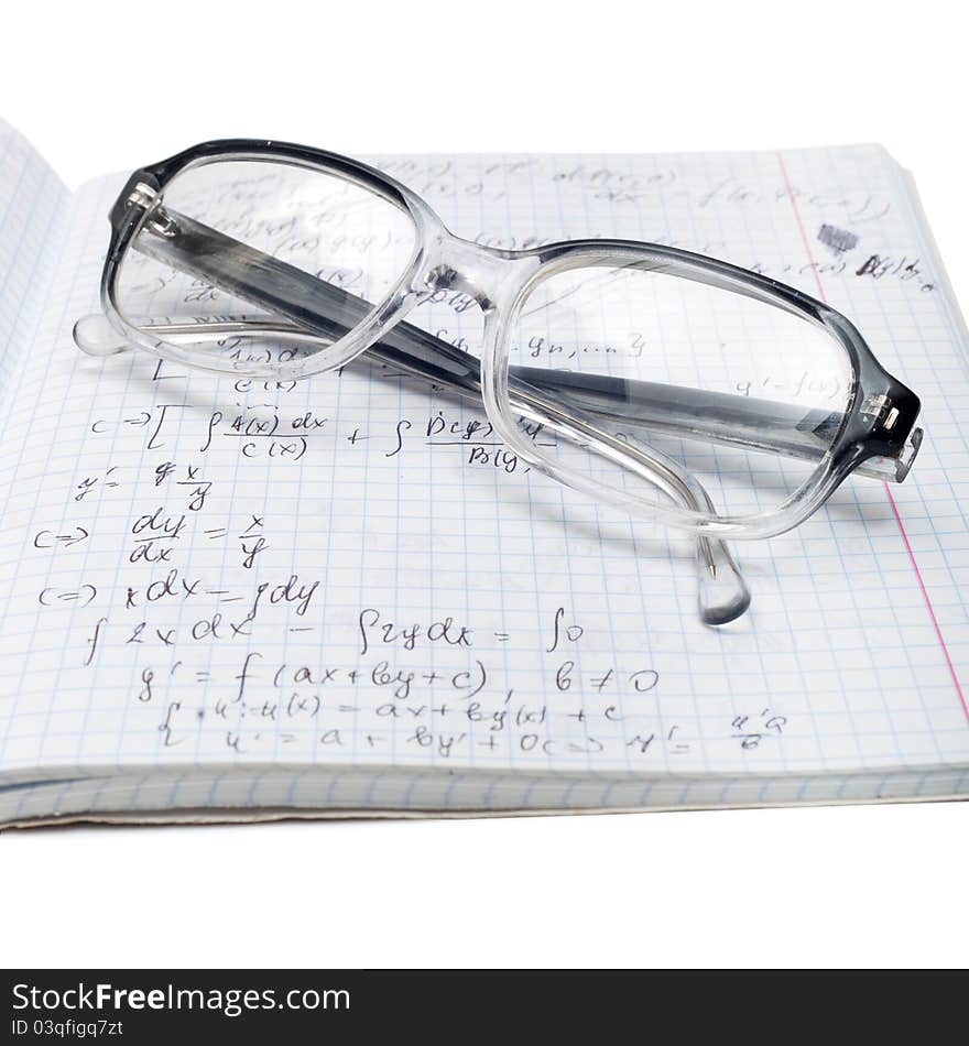 Copybook of physics with glasses isolated on white