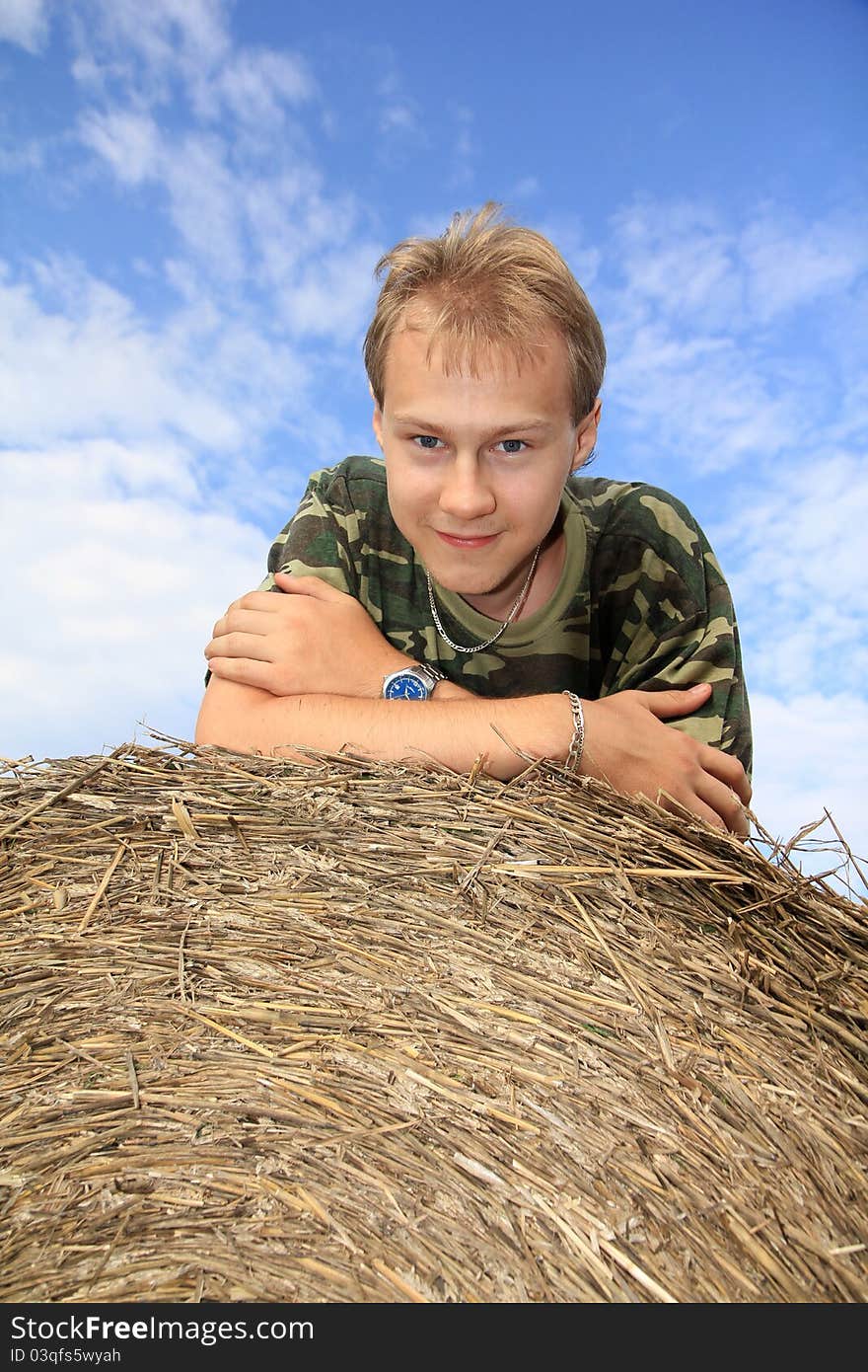 Boy on straw bale