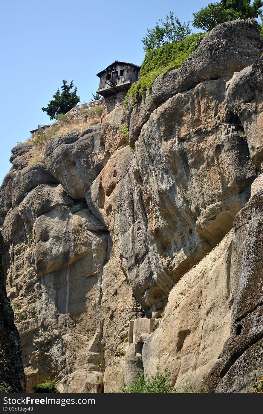 Small wooden house on top of rock. meteora. Small wooden house on top of rock. meteora