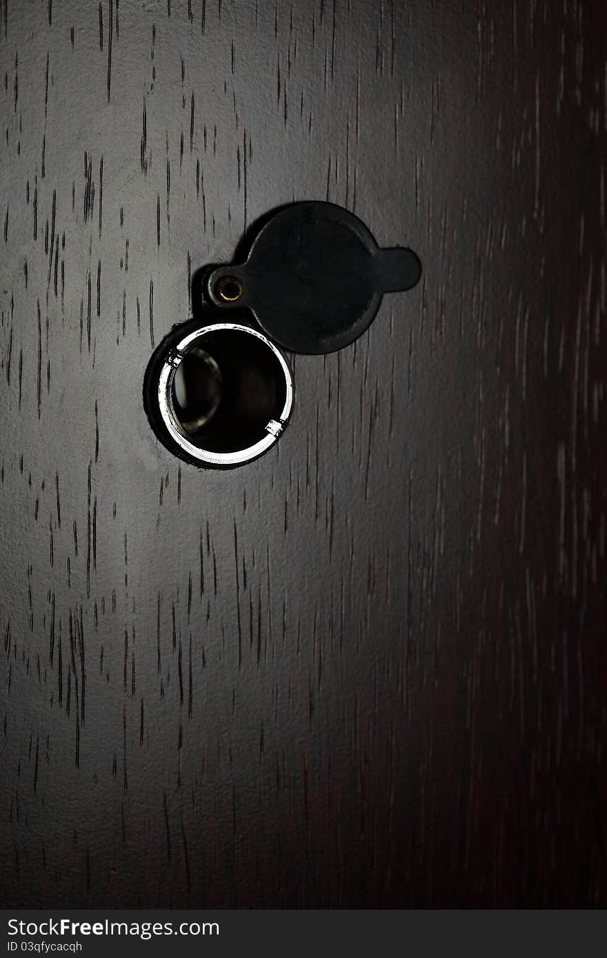 Peephole on wooden door