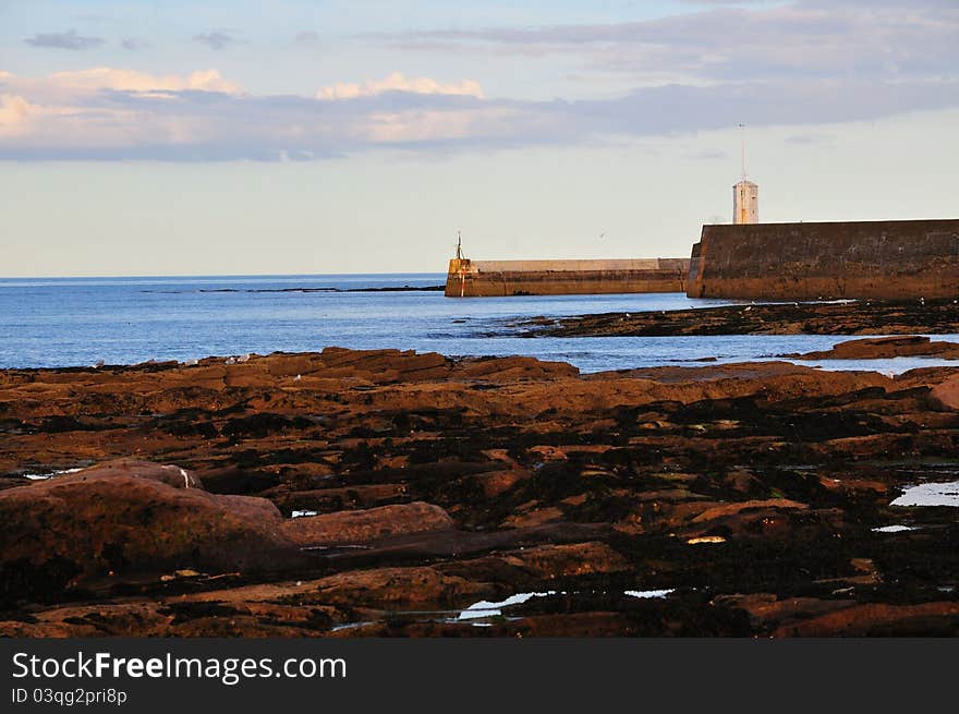 Harbour mouth of a small fishing village on the Northumbrian coast. Harbour mouth of a small fishing village on the Northumbrian coast.