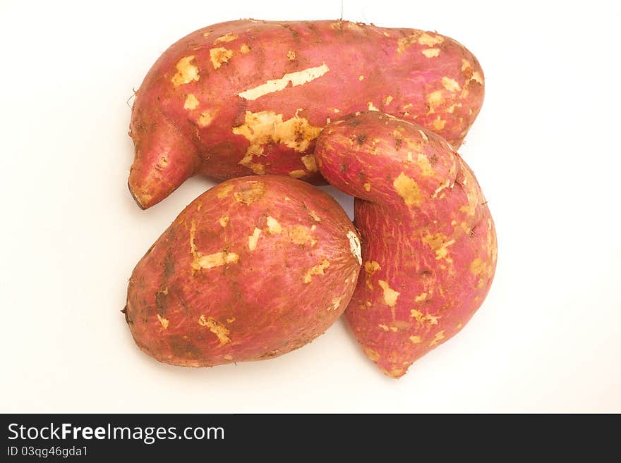 Closeup shot of three sweet potatoes. Closeup shot of three sweet potatoes.