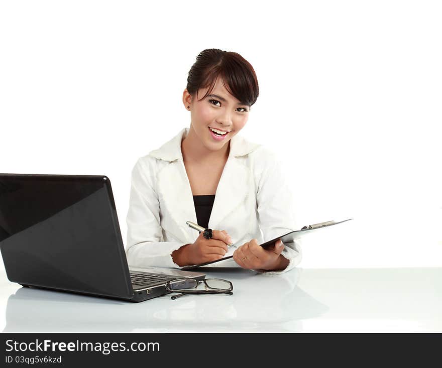 Image of young employer looking at camera while working. isolated on white